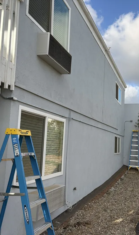 Exterior lighting work on an apartment building