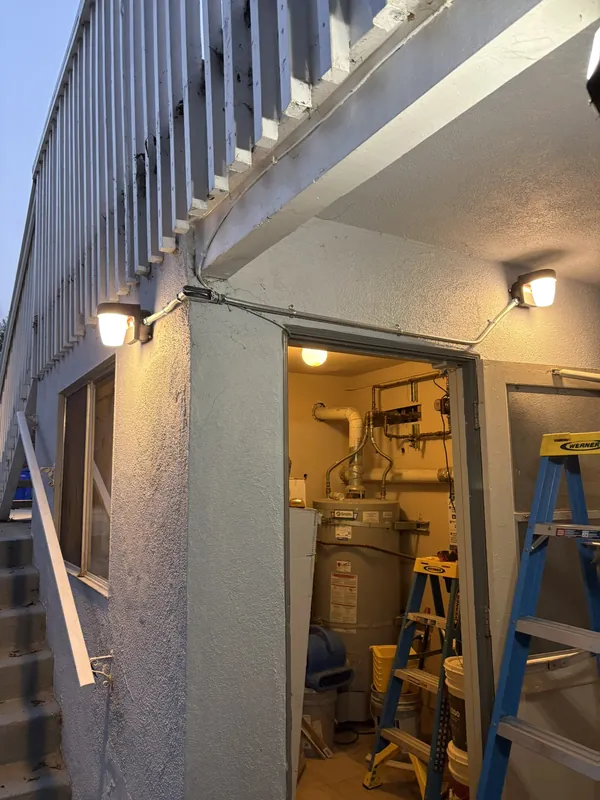 New wall lights at an apartment utility room entrance