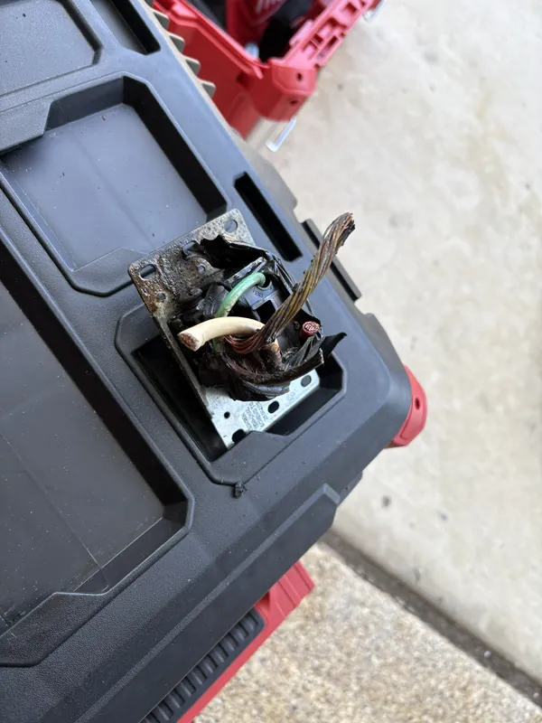 Close-up of a heat-damaged receptacle that was replaced