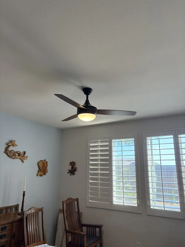 Ceiling fan with light installed in a dining room