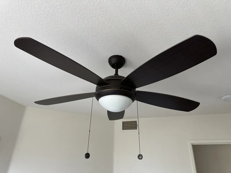 Five-blade ceiling fan with light kit installed