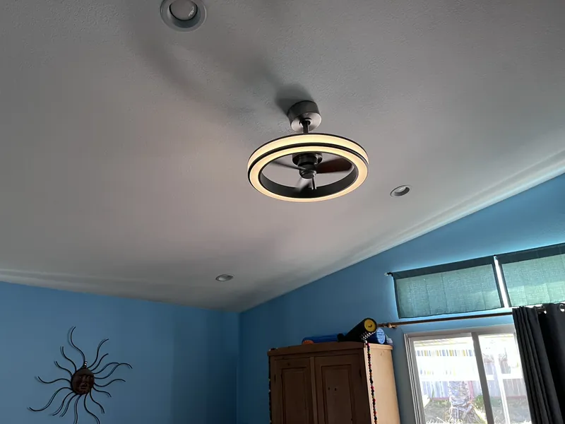 Modern bladeless ceiling fan with LED ring light