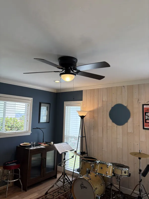 Ceiling fan with light installed in a music room