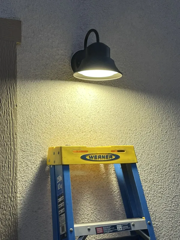 New exterior barn-style wall light installed
