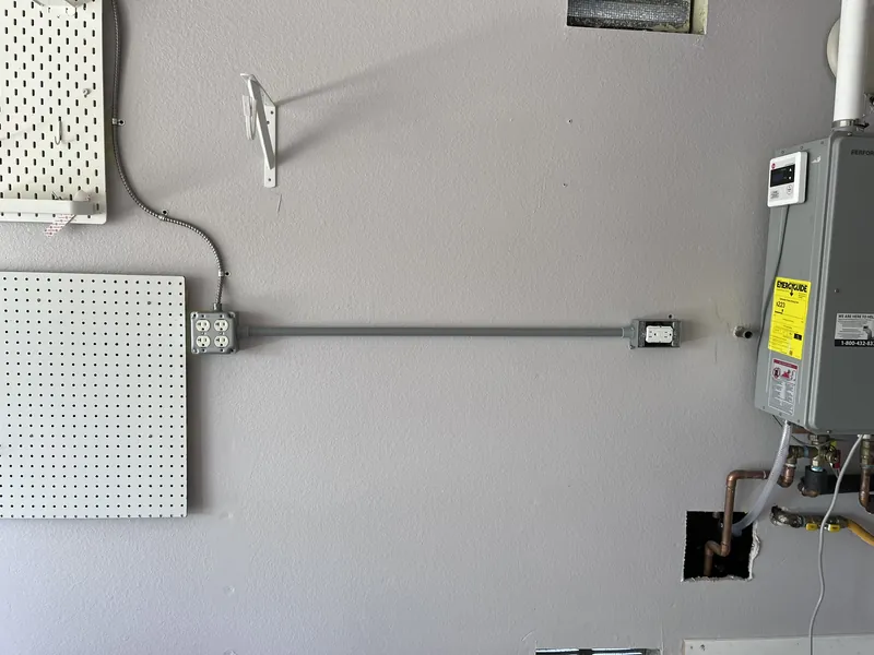 New circuit run in conduit to a water heater in a garage