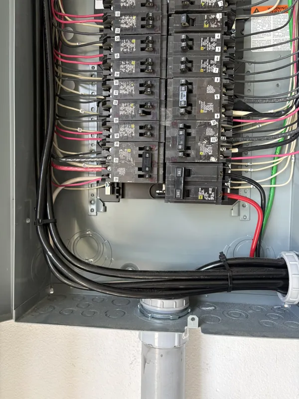 Neatly dressed wiring and breakers in a new panel