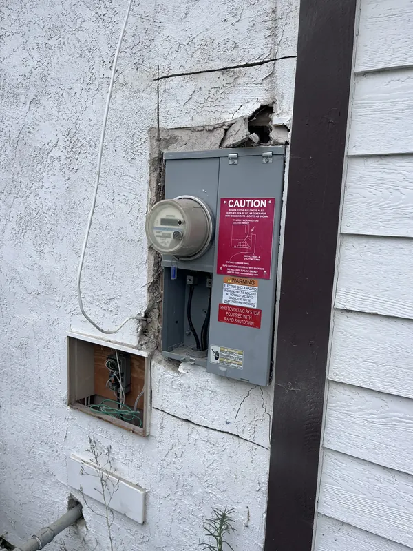 Old electrical panel and meter before an upgrade