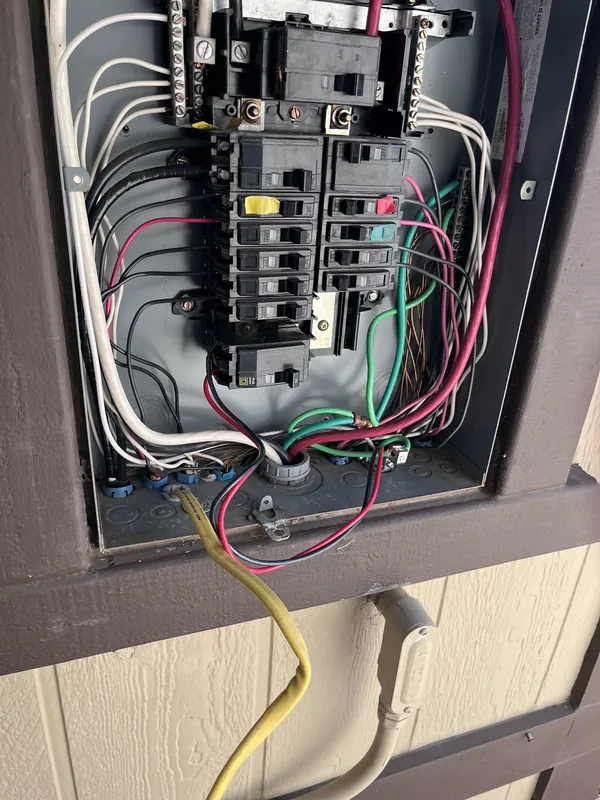 Electrical panel interior with new breakers and wiring