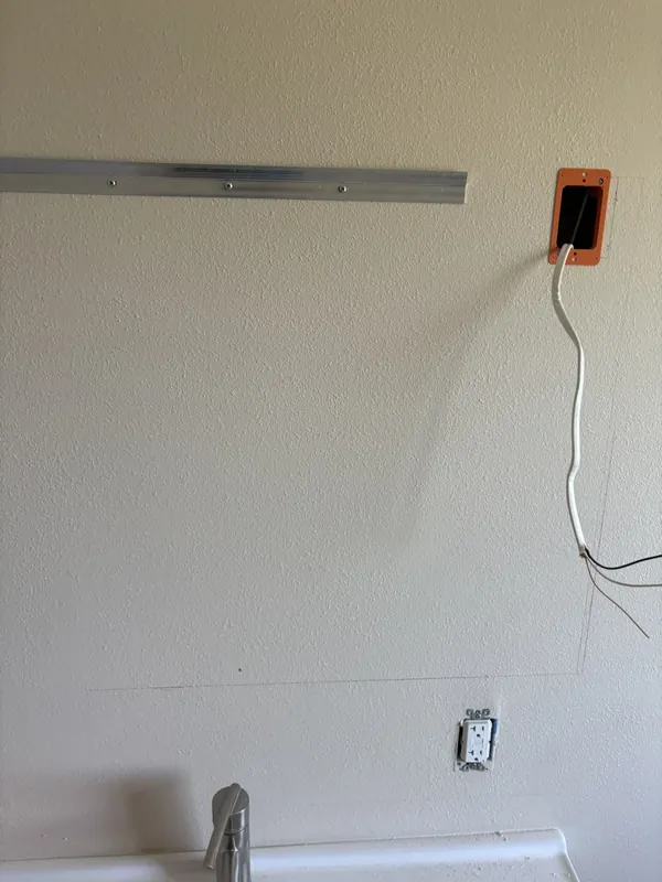New wiring and outlet prepared for a lighted vanity mirror